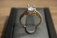 14 K Gold Ring Cubic Zirconia ring with small stones around  Size: 7 2.8 G