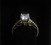 14 K Gold Ring Cubic Zirconia ring with small stones around  Size: 7 2.8 G