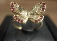 14 K Gold Ring A butterfly-shaped ring with ruby stones 3.6 G