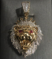 14 K Gold Charm A lion-shaped pendant with diamond stones and ruby on the eyes