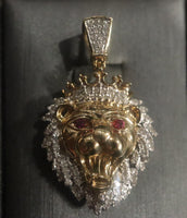 14 K Gold Charm A lion-shaped pendant with diamond stones and ruby on the eyes